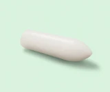 Photograph of a DulcoLax Suppository laying on a light green background